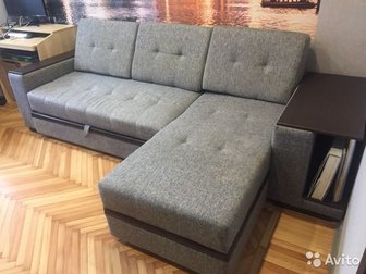 Продаю угловой диван,  Характерная особенность модели – встроенный журнальный столик,  Диван выполнен из  рогожки в сочетании с экокожей,  Диван оборудован вместительным в Ростове-на-Дону